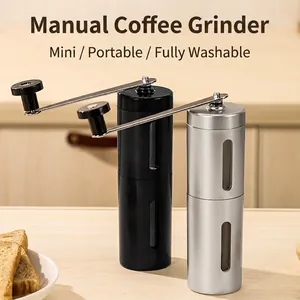 Portable manual coffee bean grinder in black and silver finish for home kitchen use.