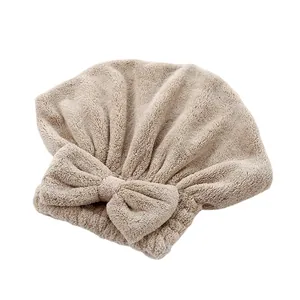 Gorro de secado de pelo de forro polar coral beige con un elegante diseño de lazo decorativo