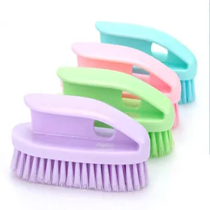 Set of four colorful plastic shoe brushes with ergonomic handles for deep cleaning.