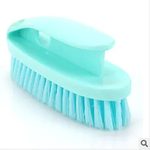 Mint green multi-purpose plastic cleaning brush with ergonomic handle and stiff bristles.