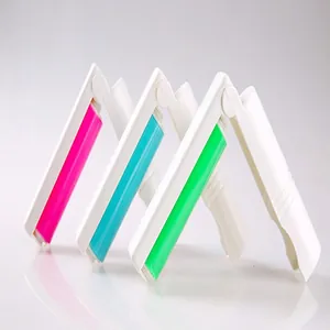 Detail view of foldable washable lint rollers in pink, cyan and green colors