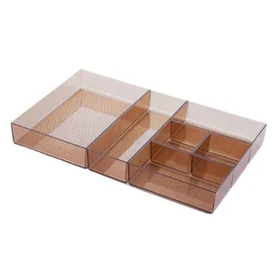 Clear amber plastic drawer organizer set for kitchen utensils and vanity storage