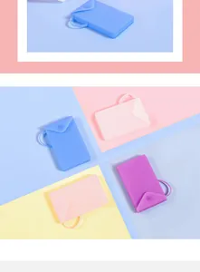 Detail view of various colorful portable silicone mask storage pouches with secure button closure