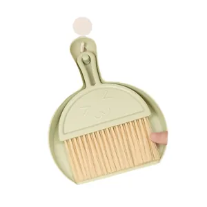 Mini desktop broom and dustpan set with cute cat face design for keyboard cleaning