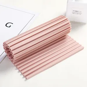 Tabla de lavar de silicona rosa flexible con superficie estriada para limpieza