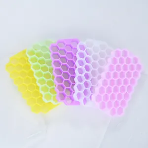 Multi-colored silicone honeycomb ice cube trays with lids and 37 compartments for freezing.