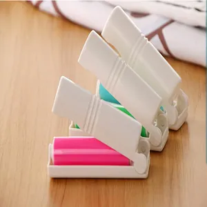 Detail showing foldable design of compact washable lint rollers in assorted colors