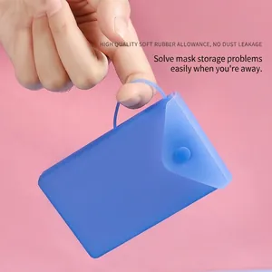 Portable blue silicone face mask storage bag with snap button and carry handle strap