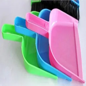Detail showing multi-colored mini desktop dustpans and brushes for keyboard cleaning