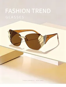 Detailed view of luxury rimless sunglasses with gold decorative side panels and rhinestones