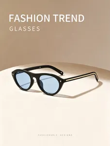 Fashionable vintage cat-eye sunglasses with light blue lenses and gold rivet accents