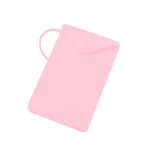 Portable minimalist pink silicone mask storage bag with snap closure and carry loop