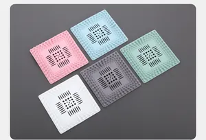 Detailed view of square silicone sink drain hair catchers in five various colors.