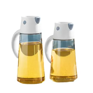 Set of two glass oil and vinegar dispensers with white lids and ergonomic handles