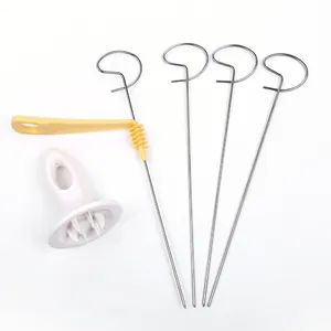 Professional manual spiral potato slicer set featuring stainless steel skewers and base.
