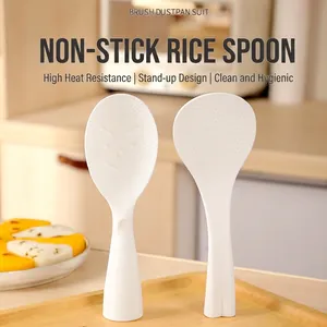 Standing non-stick white rice spoon made of food-grade PP plastic for convenient home use.