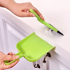 Mini green broom and dustpan set for desktop keyboard cleaning usage