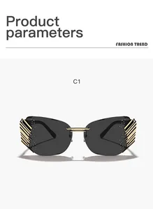 Close-up of modern rimless sunglasses with gold side accents and dark grey lenses