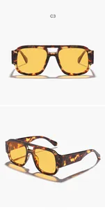 Vista detallada de gafas de sol de aviador retro con lentes amarillas y montura de carey
