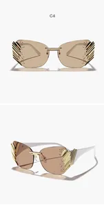 Fashionable oversized rimless sunglasses with tan lenses and ornate gold temples