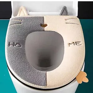 Cute cat-themed plush toilet seat cover with warm velvet material and 'HOME' embroidery