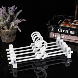 Set of 5 white adjustable plastic pants hangers with non-slip clips for skirts and trousers