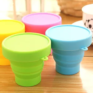 Food-grade collapsible silicone travel cups with lids in assorted bright candy colors