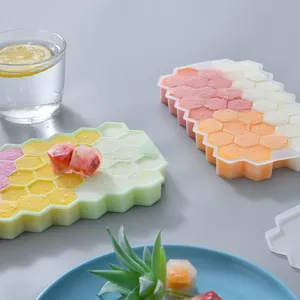 Honeycomb silicone ice cube trays with lids for 37 hexagonal ice cubes in vibrant colors