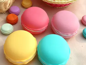 Close-up of colorful macaron-shaped jewelry storage boxes in various pastel shades