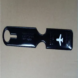 Macro view of a black long strip airplane luggage tag featuring a white aircraft icon