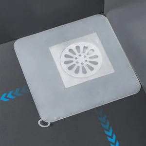 Vue détaillée du couvercle de siphon carré en silicone avec un centre perforé blanc