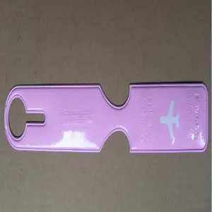 Detailed close-up of a pink long-strip luggage tag featuring engraved airplane icons and text