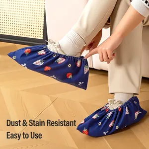 Reusable strawberry pattern cloth shoe covers for kids featuring indoor anti-slip protection