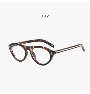 Detail view of retro tortoiseshell cat-eye glasses frame with metallic rivet accents