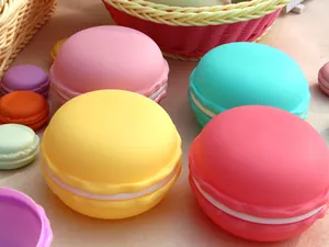 Close-up of colorful macaron-shaped jewelry storage boxes for necklaces and earrings