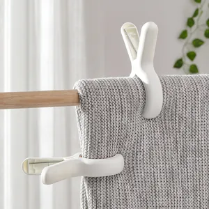 Set of large white windproof plastic laundry clips for securing quilts and blankets