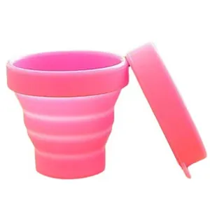 Pink food-grade silicone collapsible cup with lid for travel and outdoor activities