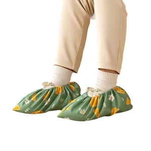 Washable green fruit pattern cloth shoe covers for kids featuring non-slip indoor soles