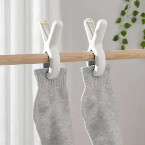 Durable white plastic windproof clothes pegs for laundry and blanket hanging storage