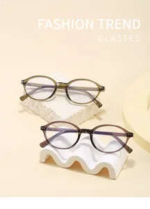 Stylish retro oval-frame blue light blocking glasses on creative white display stands
