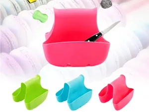 Detail view showing a saddle-style sink sponge holder available in various vibrant colors
