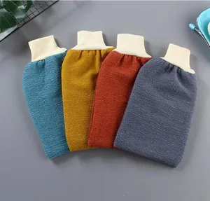 Close-up detail of four textured exfoliating bath mitts in various muted color options