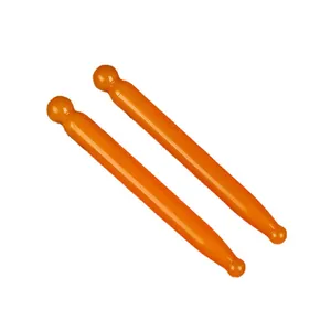 Pair of professional orange resin massage rods for facial gua sha and acupoint therapy.