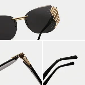 Modern rimless sunglasses with gold accents and rhinestones for a trendy streetwear look