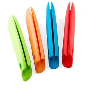 Close-up detail of soft silicone grocery bag handle grips in bright candy colors