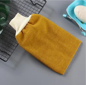 Detailed macro view of thickened double-sided exfoliating bath mitt with textured surface