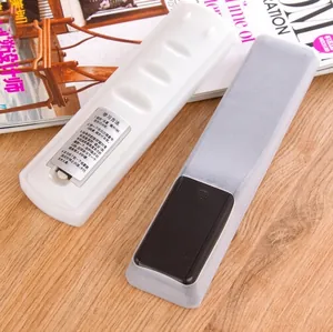 Durable translucent silicone TV remote control protective covers on a wooden surface