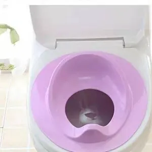 Comfortable purple baby potty training seat ring installed on white bathroom toilet