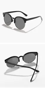 Detailansicht der runden Halbrand-Kinder-Sonnenbrille in Schwarz und Silber-Finish.