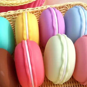 Set of colorful macaron-shaped portable jewelry storage boxes inside a woven basket